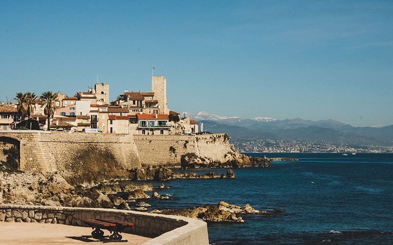 Dark blue ocean with buildings off the coast