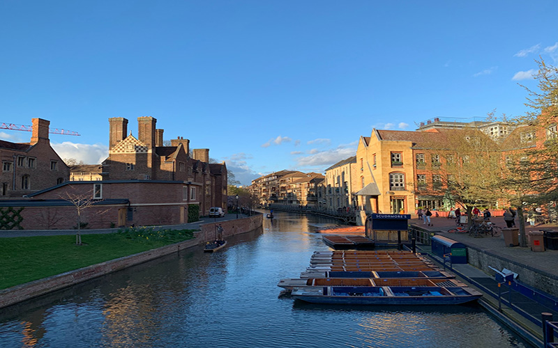 Punting boats along the river in Cambridge